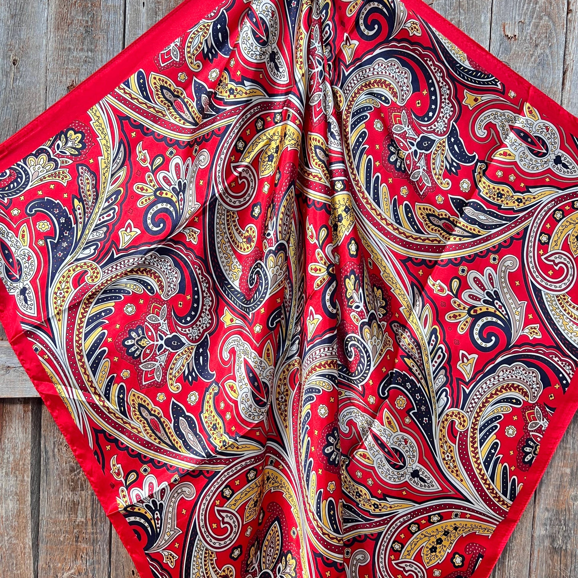 Ruby Red Hippie Paisley 35 inch western wild rag scarf for women styled as a cowgirl neck scarf.