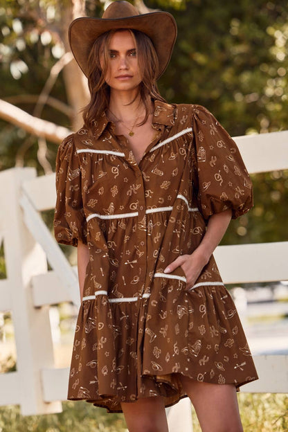 Woman wearing a brown patterned dress and hat outdoors