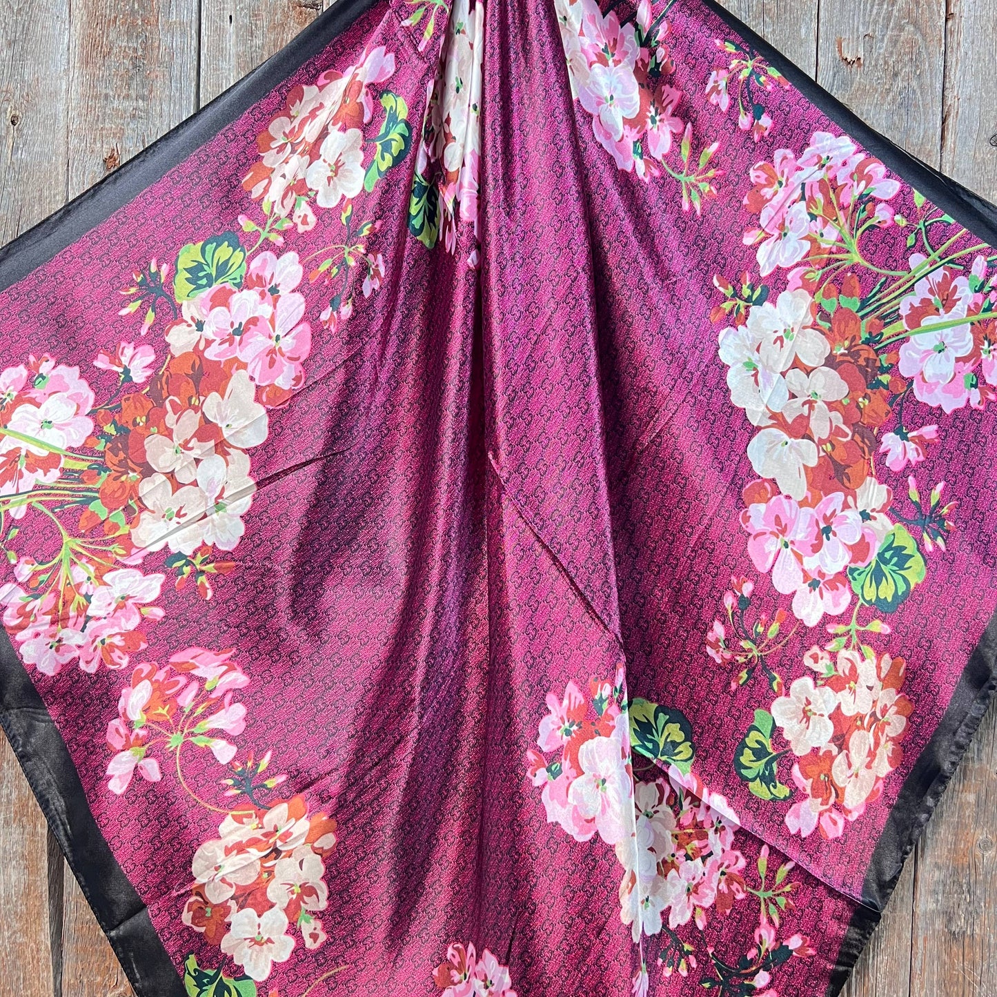 Dark pink cherry blossom western wild rag scarf styled as a silky cowgirl neck scarf for rodeo and western fashion.