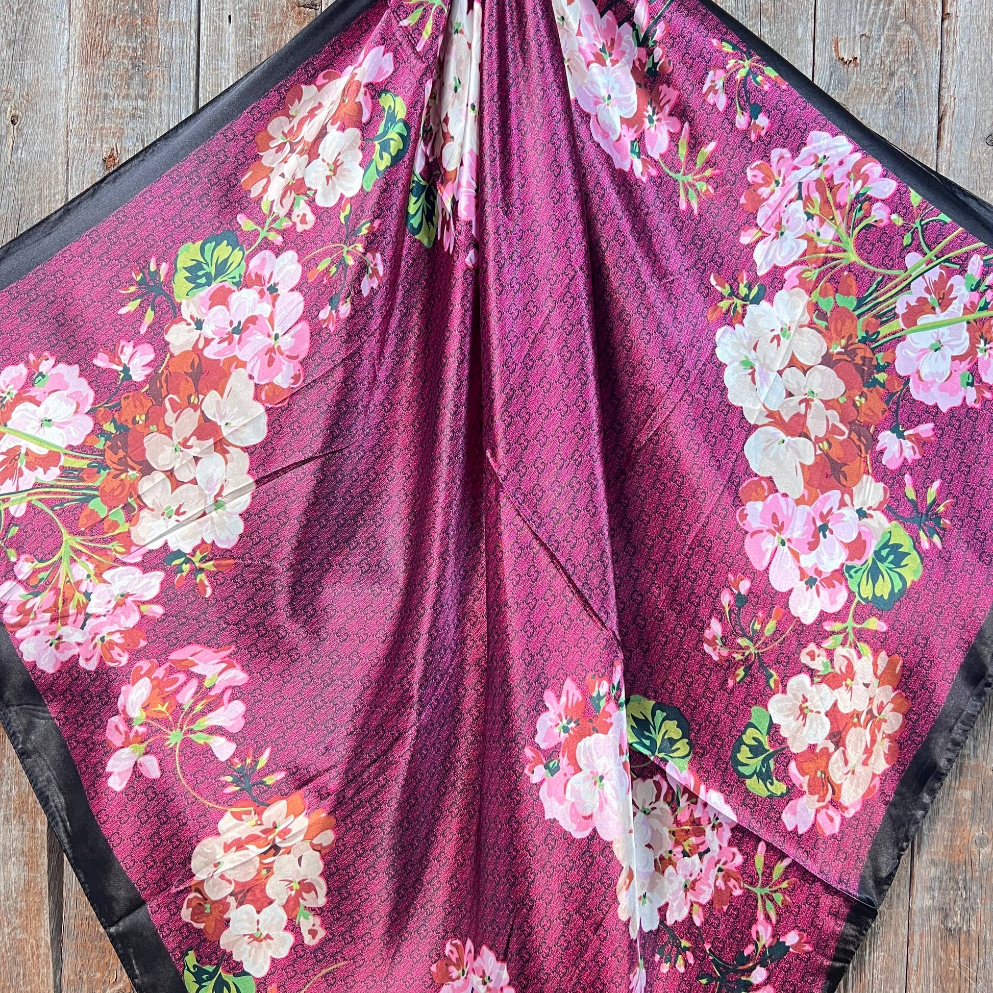 Dark pink cherry blossom western wild rag scarf styled as a silky cowgirl neck scarf for rodeo and western fashion.