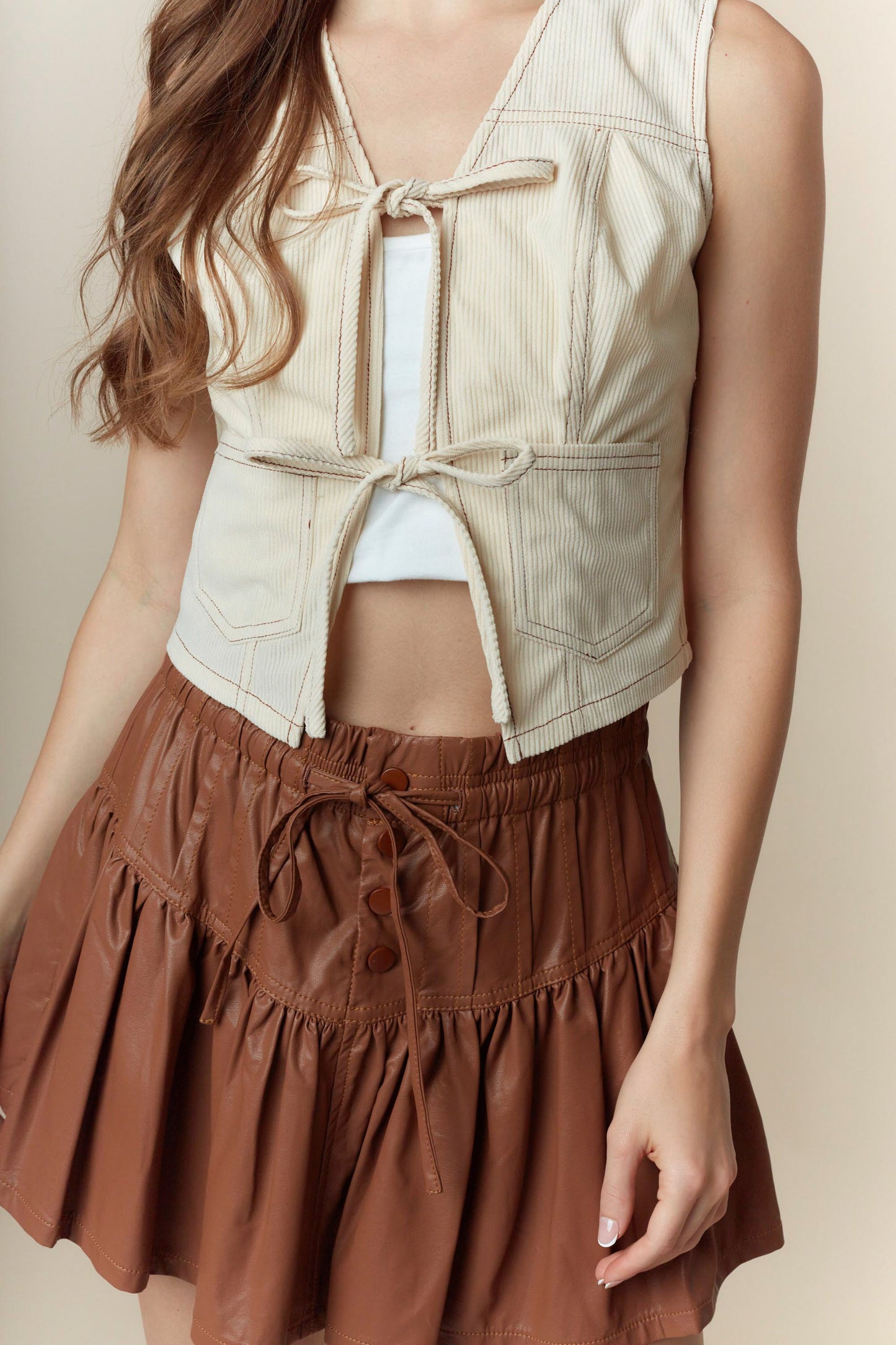 Faux Leather Bow-Tied Ruffle Mini Skirt with Pin-Tuck Detail