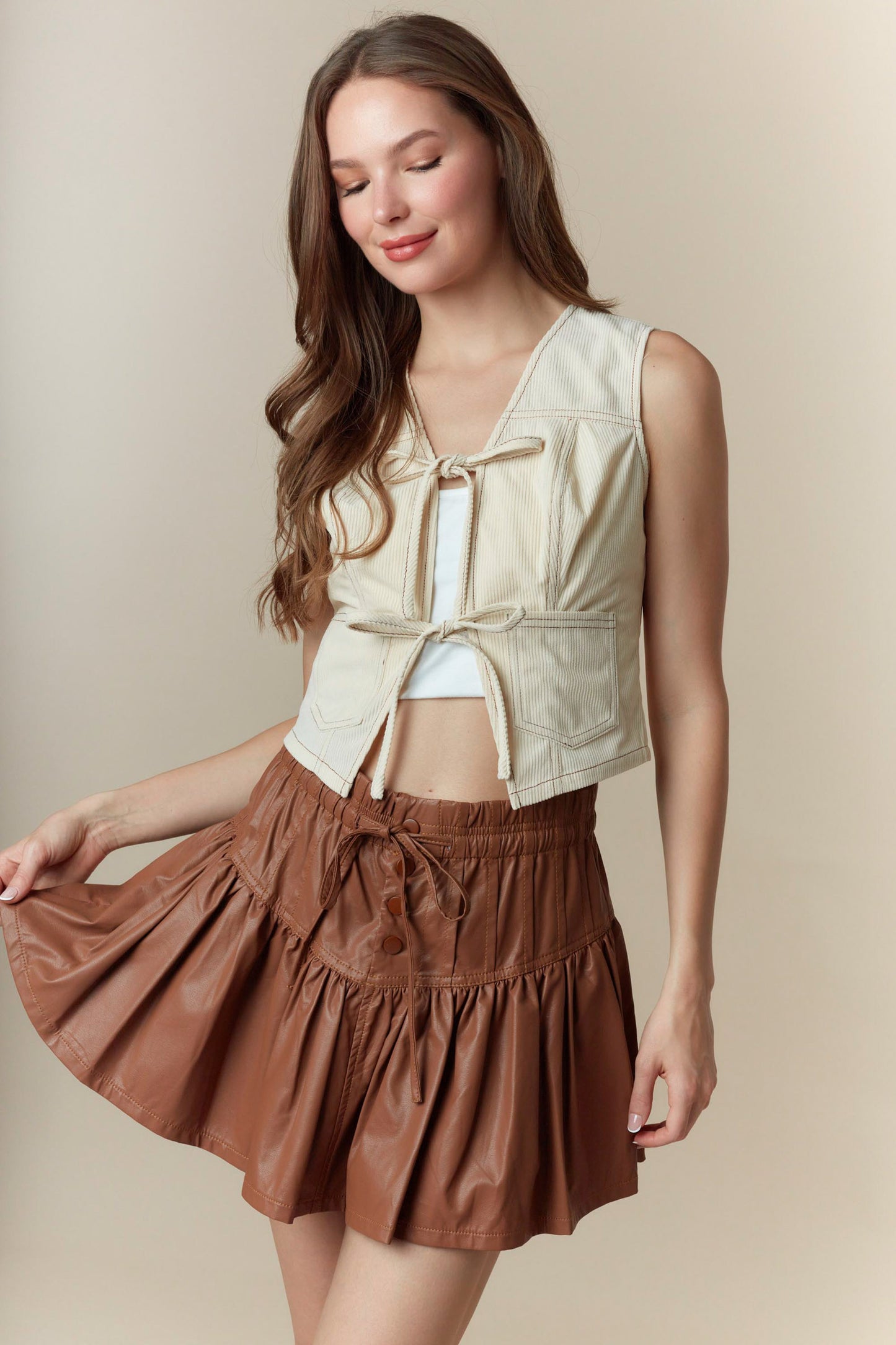 Faux Leather Bow-Tied Ruffle Mini Skirt with Pin-Tuck Detail